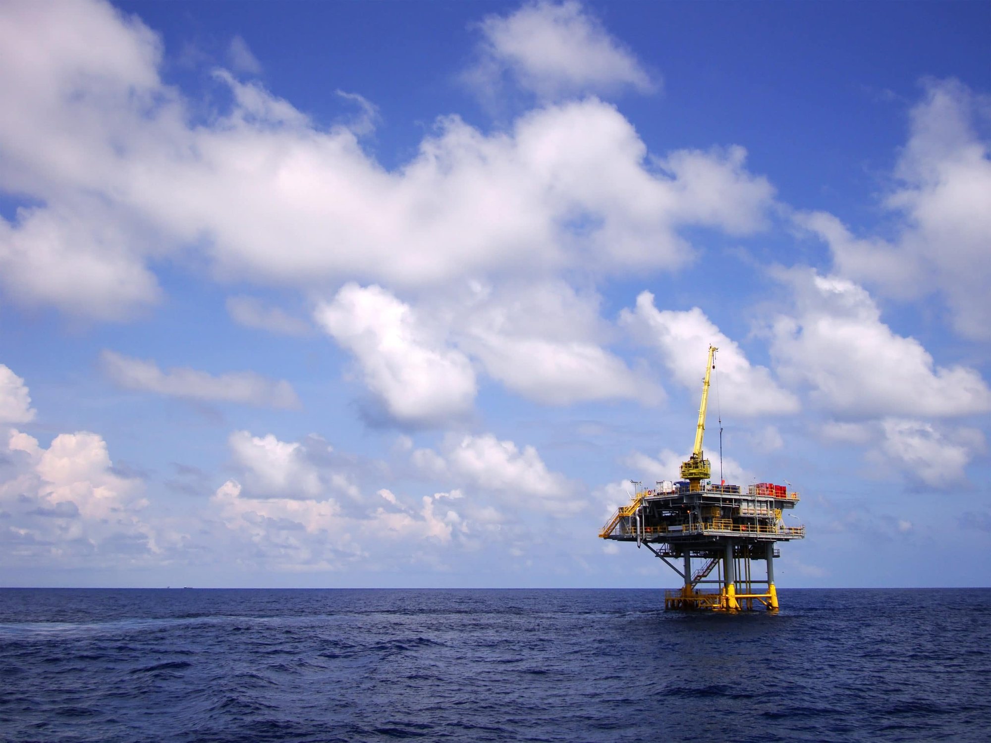 Subsea Oil and Gas Rig with Calm Sea and Clouds Image