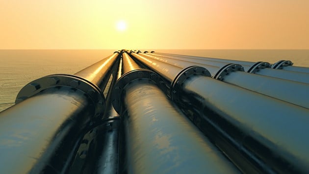 Pipelines Above Water and Sunset Image